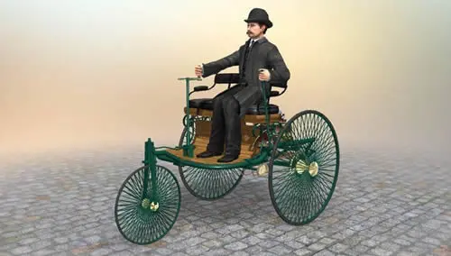 Vintage three-wheeled automobile with a driver