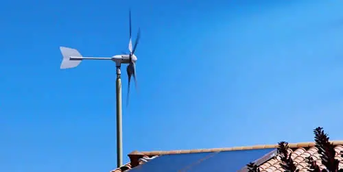 Wind turbine and solar panels on roof