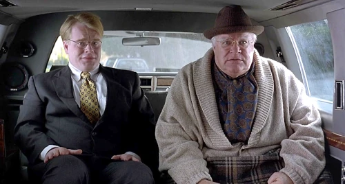 Two men sitting in a limousine interior