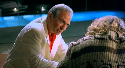 Two people in conversation indoors